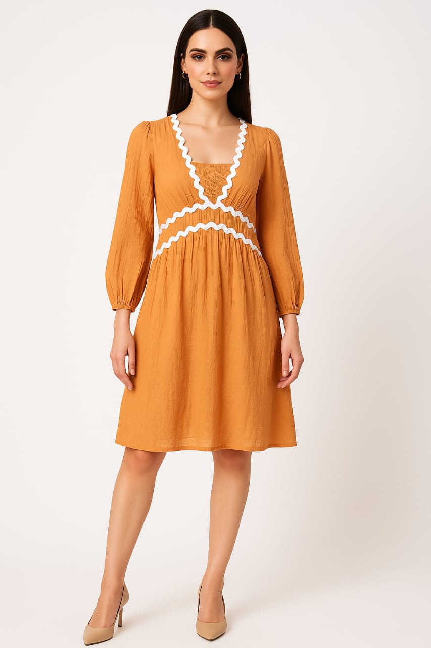 Why Everyone Is Talking About the Voxelle Mustard Dress This Season